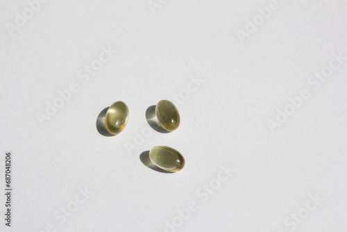 
Transparent pills on a white background.