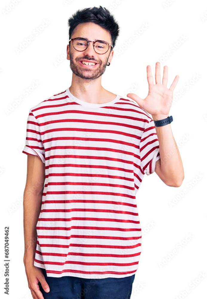 Young hispanic man wearing casual clothes showing and pointing up with fingers number five while smiling confident and happy. Young hispanic man wearing casual clothes showing and pointing up with fingers number five while smiling confident and happy.