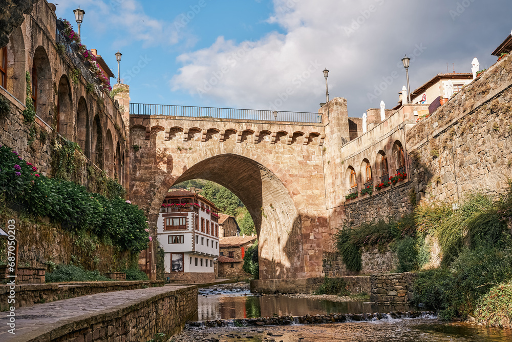 Potes medieval town with bridge and Deva river in its path. In the Liebana region, Cantabria, Spain.