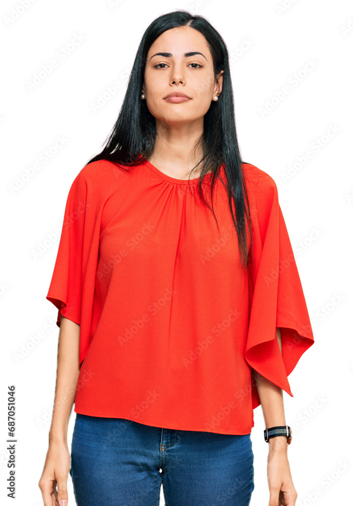 Beautiful young woman wearing casual clothes relaxed with serious expression on face. simple and natural looking at the camera. Beautiful young woman wearing casual clothes relaxed with serious expression on face. simple and natural looking at the camera.