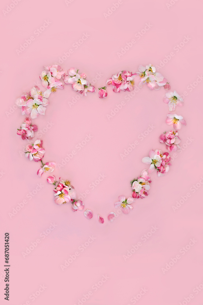 Heart shaped apple blossom flower wreath for Spring. Abstract minimal design for Valentines, Easter, Mothers Day, birthday for card, logo, gift tag or invitation on pink. 