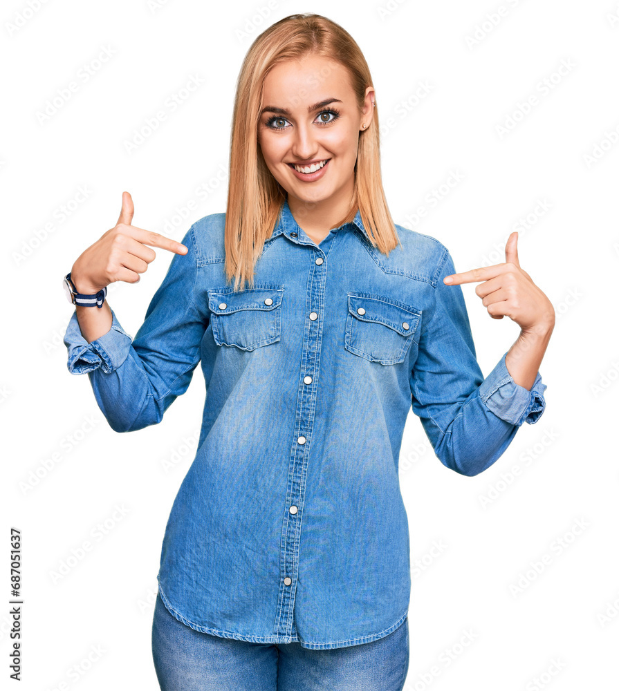 Beautiful caucasian woman wearing casual denim jacket looking confident with smile on face, pointing oneself with fingers proud and happy. Beautiful caucasian woman wearing casual denim jacket looking confident with smile on face, pointing oneself with fingers proud and happy.