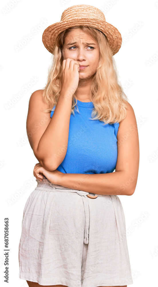 Young blonde girl wearing summer hat looking stressed and nervous with hands on mouth biting nails. anxiety problem. Young blonde girl wearing summer hat looking stressed and nervous with hands on mouth biting nails. anxiety problem.