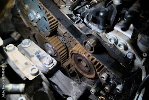 Timing belt and rollers on a car engine. The gas distribution mechanism of a car engine. Timely routine maintenance of cars at a car service center