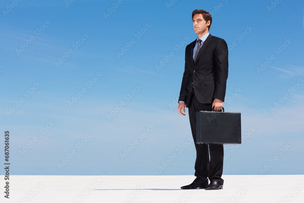 Briefcase, sky and business man on thinking of future on building rooftop in the city. Idea, bag and professional male person from Canada standing and dream, brainstorm or planning for work project. Briefcase, sky and business man on thinking of future on building rooftop in the city. Idea, bag and professional male person from Canada standing and dream, brainstorm or planning for work project.