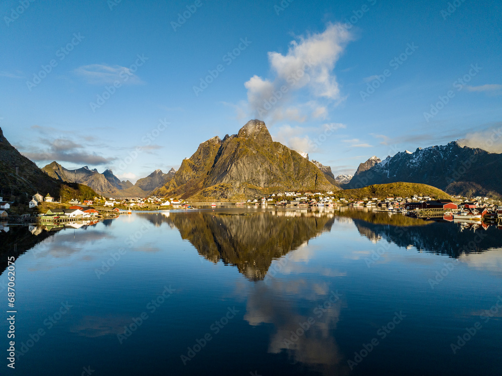 view of Rostad kirkefjorden mountain with clouds appear from the peak like from the volcano on lofoten island view from reine village