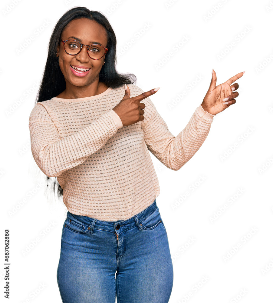 Young black woman wearing casual clothes and glasses smiling and looking at the camera pointing with two hands and fingers to the side. Young black woman wearing casual clothes and glasses smiling and looking at the camera pointing with two hands and fingers to the side.