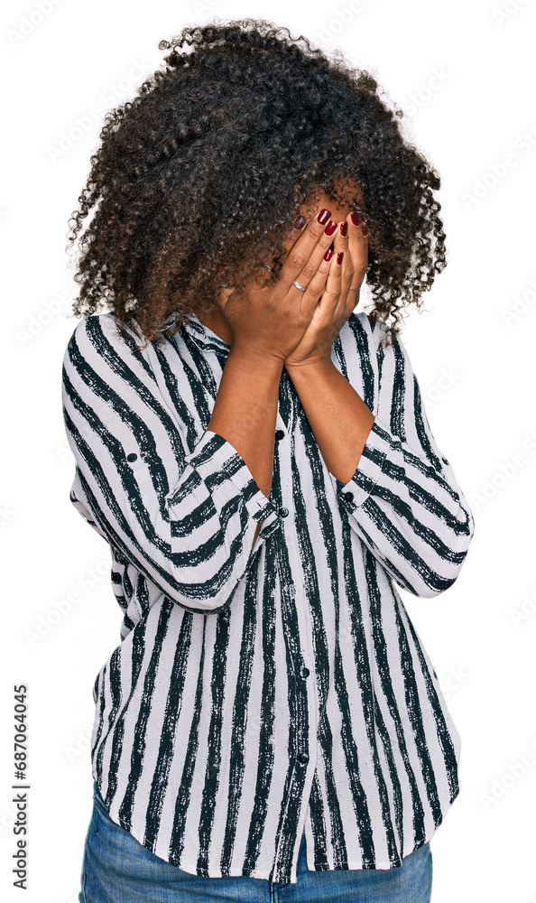 Young african american girl wearing casual clothes with sad expression covering face with hands while crying. depression concept. Young african american girl wearing casual clothes with sad expression covering face with hands while crying. depression concept.