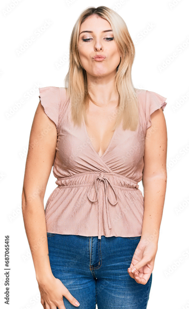 Young caucasian woman wearing casual clothes making fish face with lips, crazy and comical gesture. funny expression. Young caucasian woman wearing casual clothes making fish face with lips, crazy and comical gesture. funny expression.