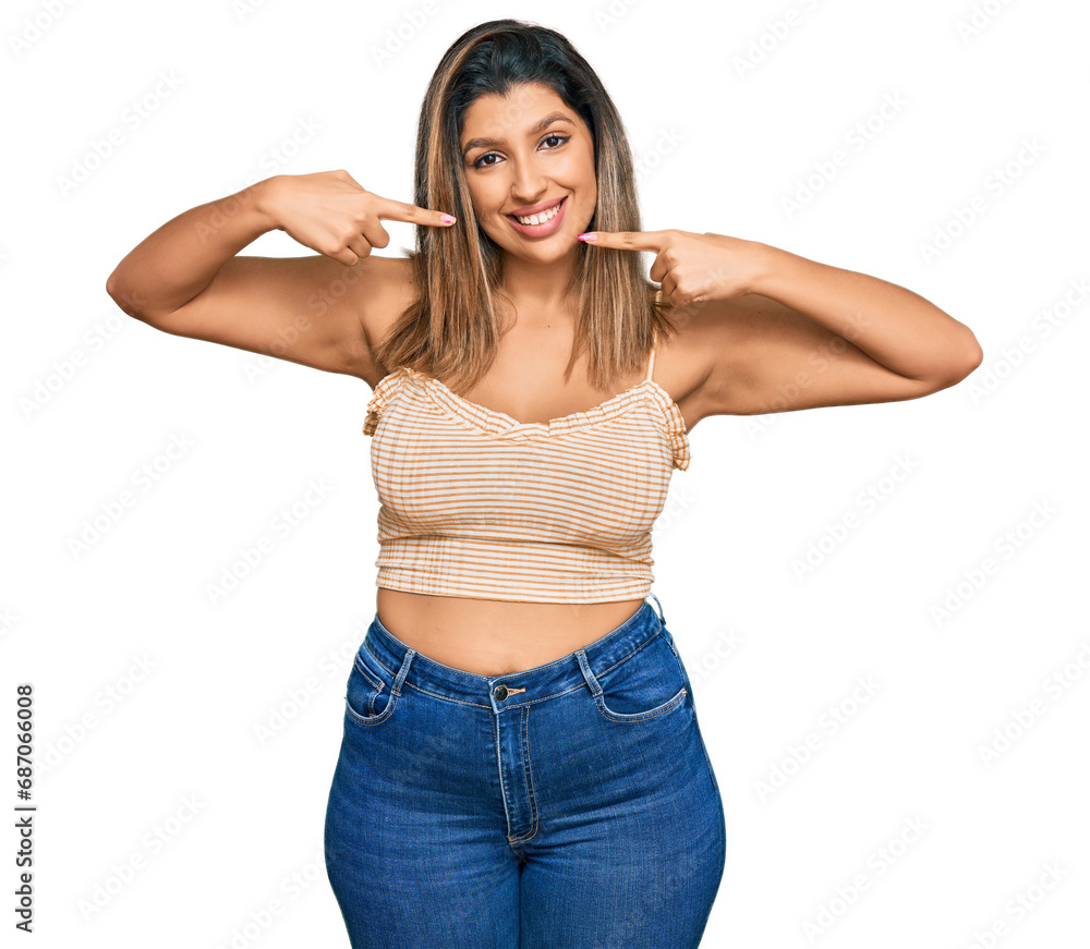 Fototapeta premium Beautiful brunette woman wearing casual clothes smiling cheerful showing and pointing with fingers teeth and mouth. dental health concept.