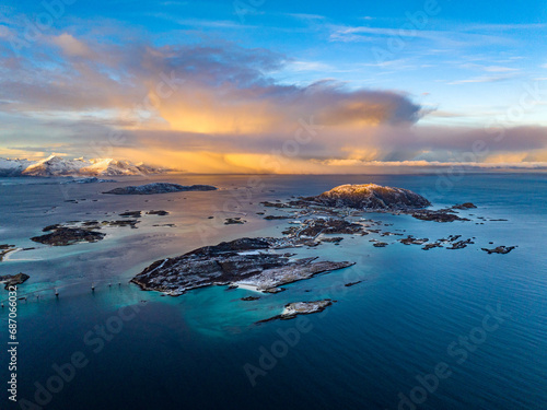 aerial view over Hillesøya and Sommarøy Islands with Storm Clouds during sunrise © Sid Smith
