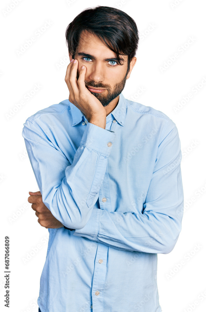 Hispanic man with blue eyes wearing business shirt thinking looking tired and bored with depression problems with crossed arms. Hispanic man with blue eyes wearing business shirt thinking looking tired and bored with depression problems with crossed arms.