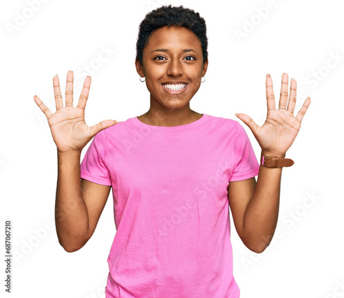 Young african american woman wearing casual clothes showing and pointing up with fingers number ten while smiling confident and happy.