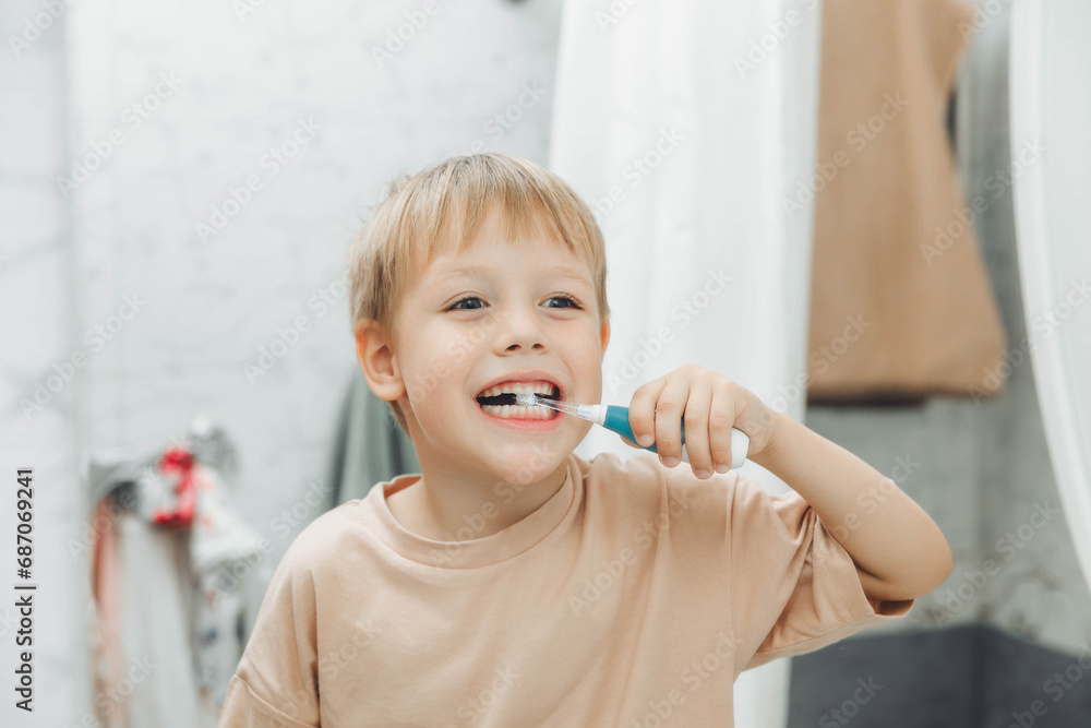 Little boy brushing his teeth in the bathroom at home Little boy brushing his teeth in the bathroom at home