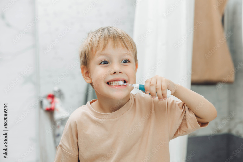 Little boy brushing his teeth in the bathroom at home Little boy brushing his teeth in the bathroom at home
