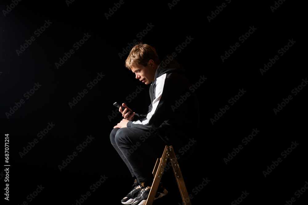 Young man in a sports suit with a smartphone Young man in a sports suit with a smartphone