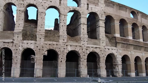 Pan right on ruins of Colosseum or Amphitheatrum Flavium largest amphitheater in the world an heritage of ancient Rome age with no people