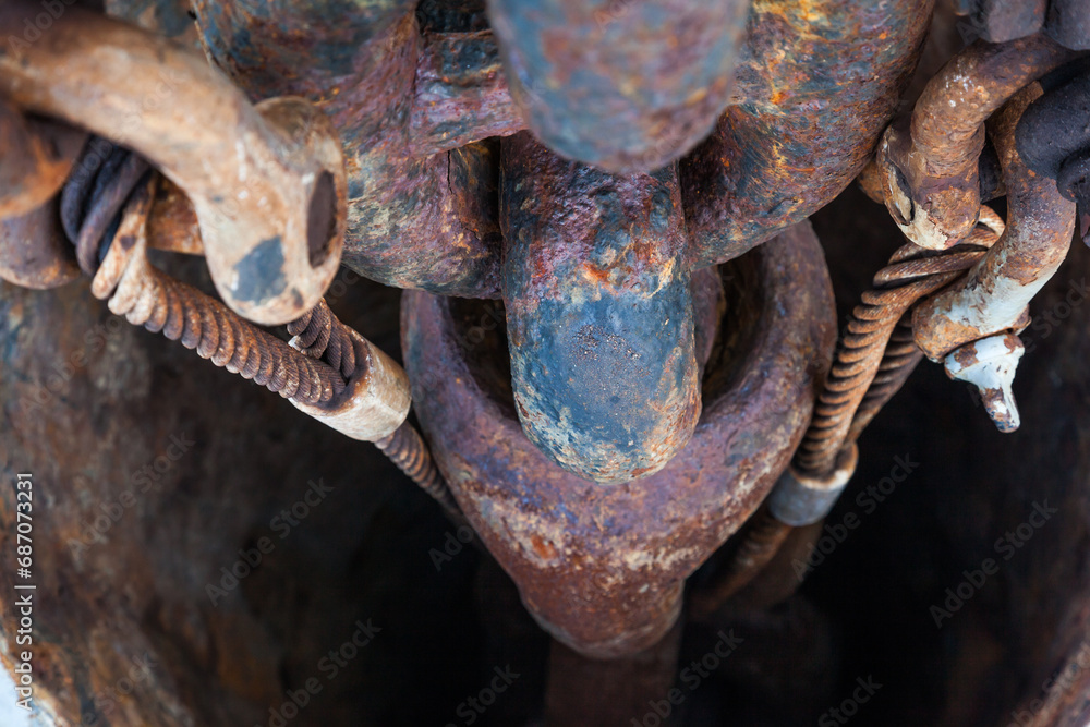 Rusty anchor chain on a ship in an anchor hawsepipe close-up. Rusty anchor chain on a ship in an anchor hawsepipe close-up.
