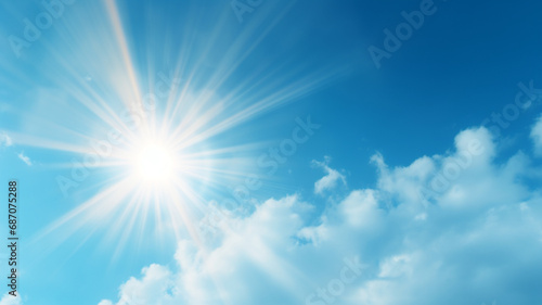 Sun in blue sky. Warm solar lens flare in clear skies © Yuwarin