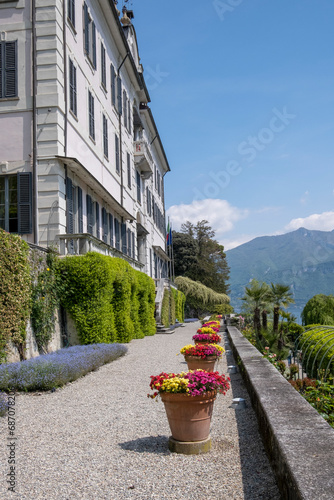 Villa Carlotta, a historic residence. Garden path in front of the Como Lake Beautiful spring day, Tremezzo Lombardy Italy
