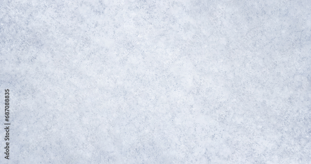 Winter background with snow patterns. Abstract background. The natural texture of snow. The surface of clean fresh snow. Panorama. Close-up view from above. New Year's background. Copy space