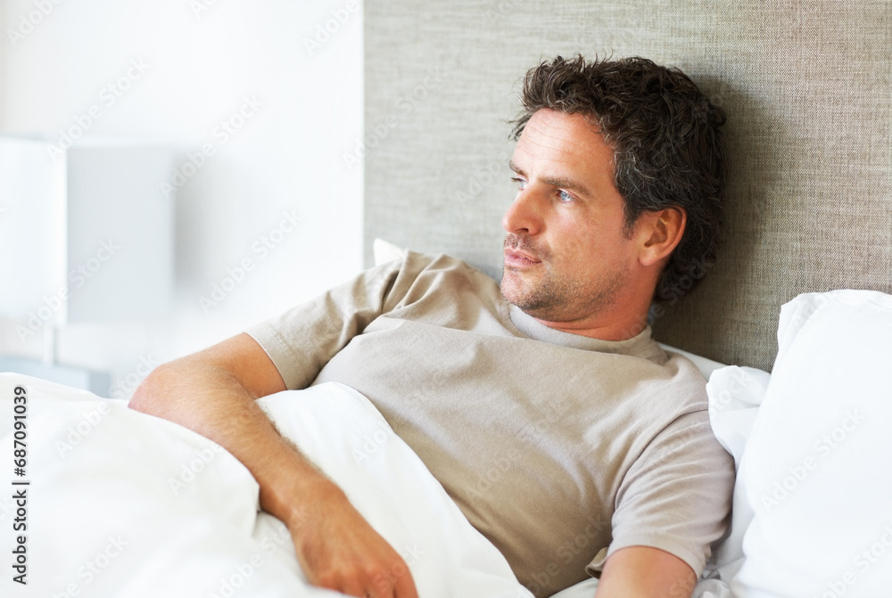 Thinking, depression and man in bed with mental health crisis, disaster or broken heart in his home. Overthinking, face and person in a bedroom with anxiety, stress or frustrated by insomnia fatigue Thinking, depression and man in bed with mental health crisis, disaster or broken heart in his home. Overthinking, face and person in a bedroom with anxiety, stress or frustrated by insomnia fatigue