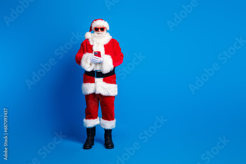 Full body photo of aged senior man instagram twitter facebook telegram wear santa claus costume coat isolated on blue color background