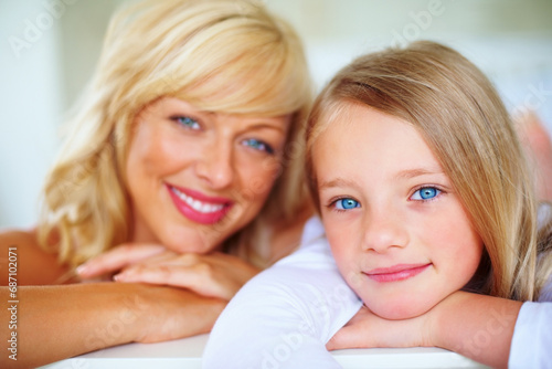 Happy, portrait and mother with girl on bed for bonding, relaxing and spending time together. Smile, love and young mom chilling and resting with kid or child from Australia in bedroom of family home