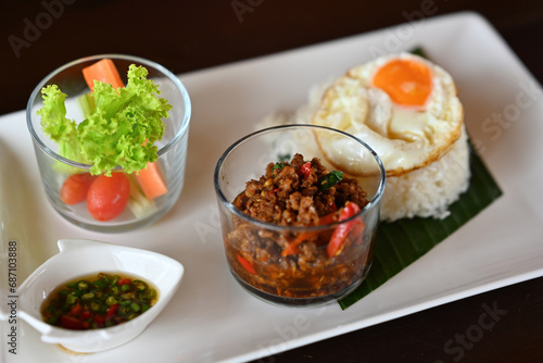 Thai modern dish of Stir-fried basil with fried egg, and rice, The famous spicy Thai food