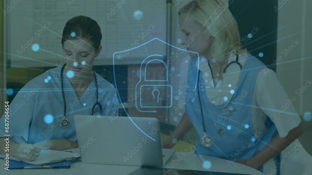Animation of padlock icon over diverse doctors using laptop in hospital Animation of padlock icon over diverse doctors using laptop in hospital