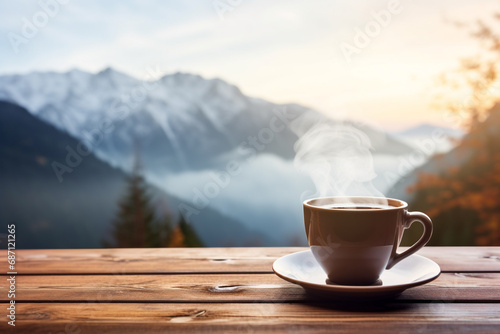 Coffee cup on wooden table with snow mountain background