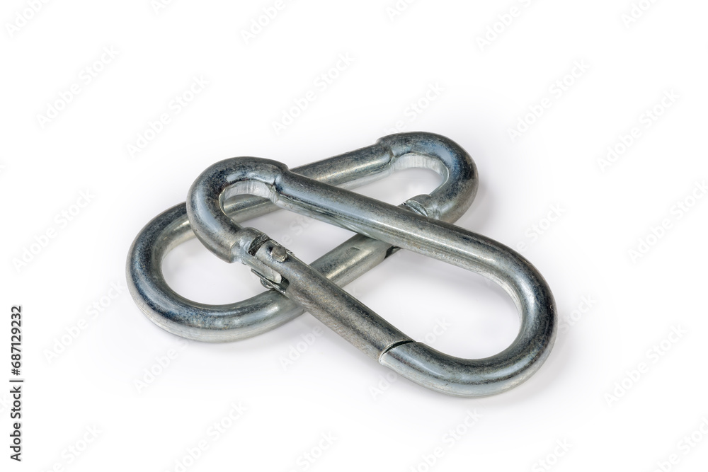 Obraz premium Two small steel snap hooks on a white background