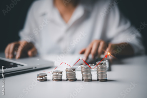 Businesswoman working with modern computer calculator virtual dashboard analyzing finance sales data and economic growth graph chart and account report technology.