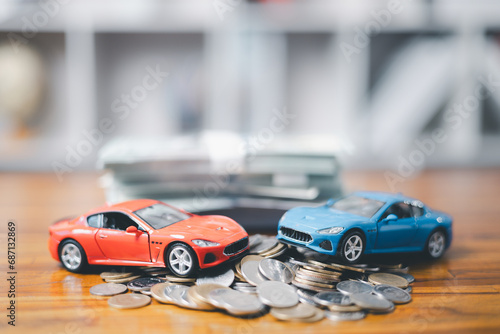 Car loan,money, banknote on agreement document or car insurance application form. Saving money for car concept, trade car for cash concept, finance concept.