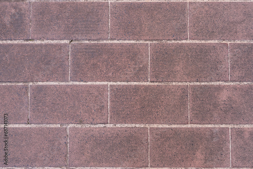 Reddish stone tile on pavement outdoor