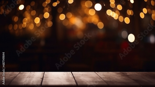Wooden table on a blurred background of bokeh lights of a night city, cafe, restaurant. Empty table for your product presentation, mockup