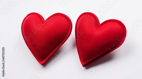 Valentine's Day. Two Valentine's Day Handmade Red Textile Hearts over white background. Valentine's Day Holiday Background with hearts. Beautiful Hearts. Holiday of Love. 