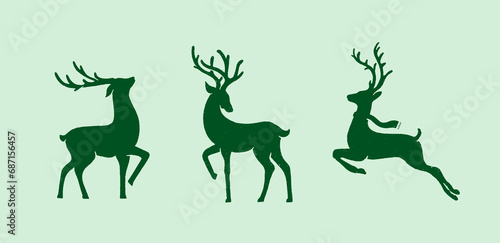 Christmas reindeer vector, silhouettes are isolated on a green background. Vector set
