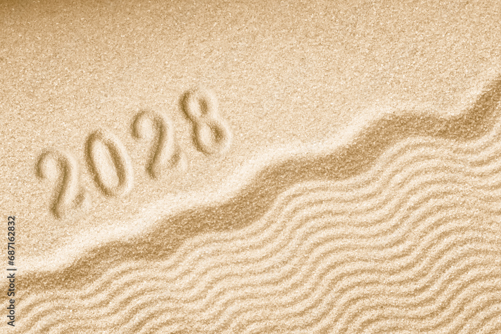 Imprints of numbers 2028 happy new year on a golden sand waves Imprints of numbers 2028 happy new year on a golden sand waves
