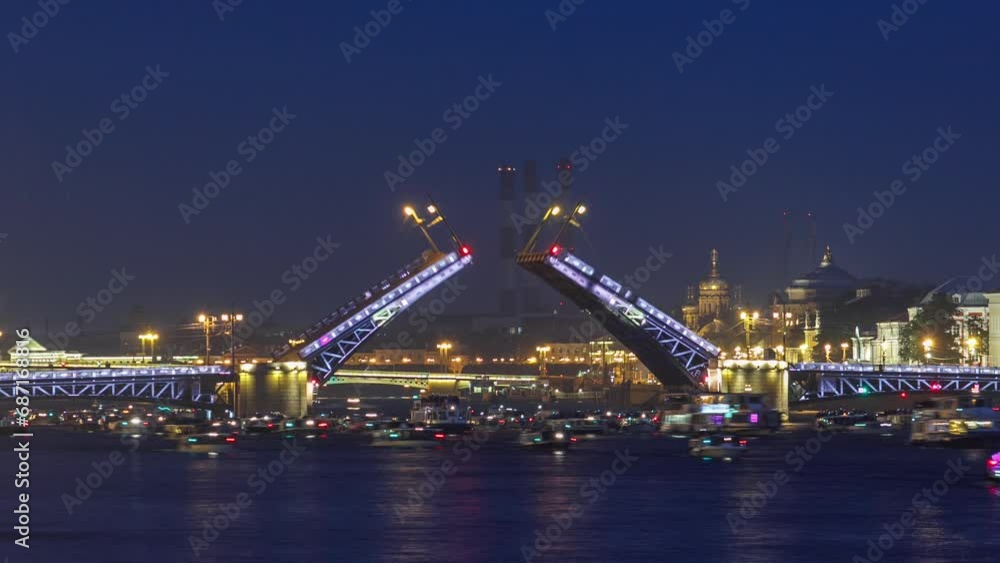 Timelapse captures the mesmerizing scene of Palace Bridge opening, bustling with observing tourists, as Neva River flows at night. A plethora of ships and boats add to the spectacle. Saint-Petersburg Timelapse captures the mesmerizing scene of Palace Bridge opening, bustling with observing tourists, as Neva River flows at night. A plethora of ships and boats add to the spectacle. Saint-Petersburg