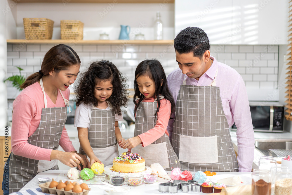 Portrait of enjoy happy love asian family father and mother with little asian girl daughter child play and having fun cooking food together with baking cookie and cake ingredient in kitchen Portrait of enjoy happy love asian family father and mother with little asian girl daughter child play and having fun cooking food together with baking cookie and cake ingredient in kitchen