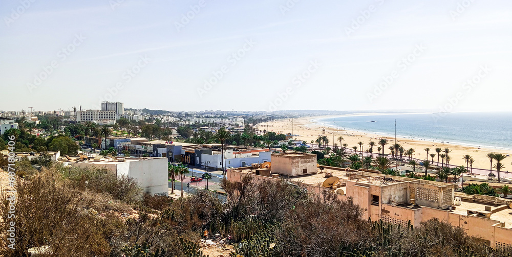 Natural view of Agadir city and nice beach on sunny day with beautiful sky.  Moroccan atlantic ocean.