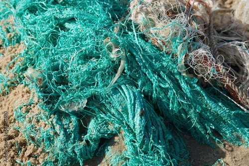 A beach  polluted by plastic waste and Fishing nets © Natalia Hanin