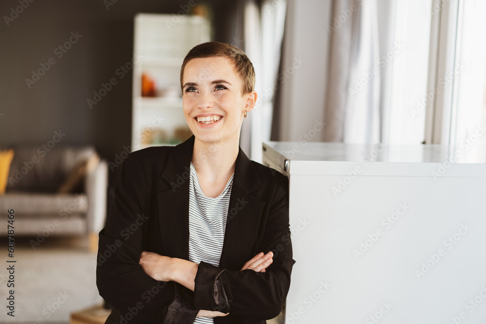 Confident Young Woman with Short Hair Laughing Joyfully in Modern Office Environment Confident Young Woman with Short Hair Laughing Joyfully in Modern Office Environment
