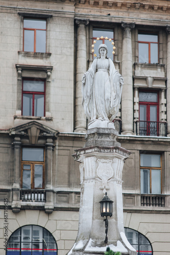 Statue of Virgin Mary at the central street of Lviv, Ukraine. Winter, snow.
