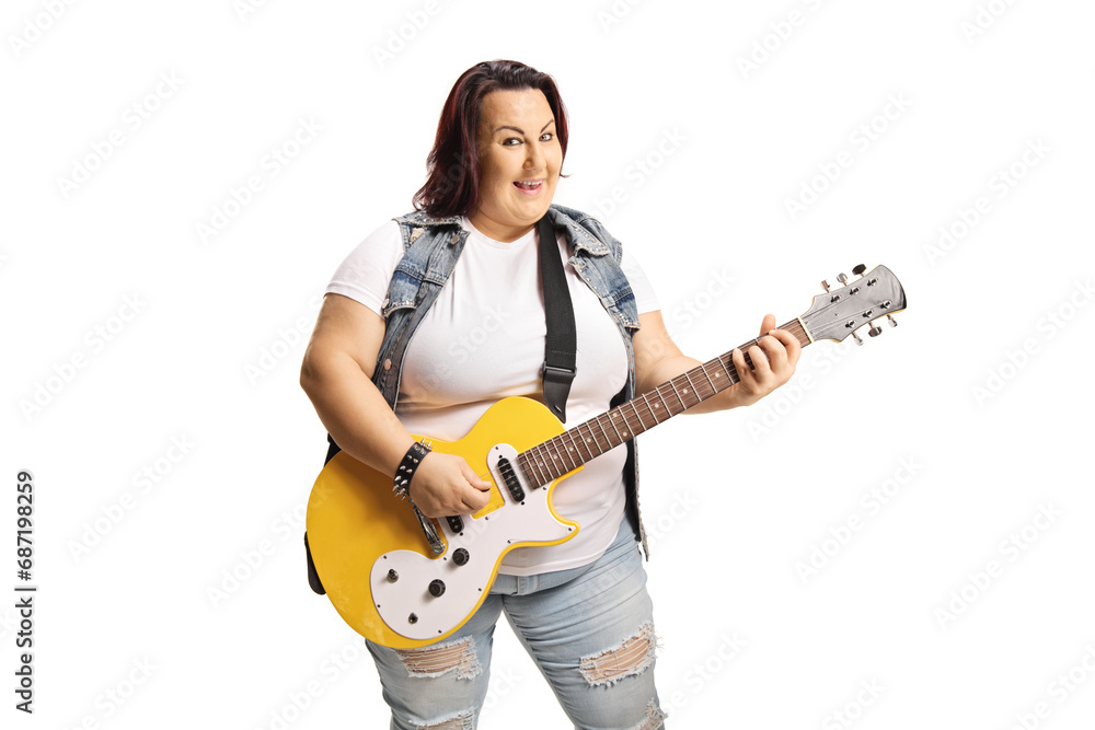 Young female playing an electric guitar and smiling Young female playing an electric guitar and smiling