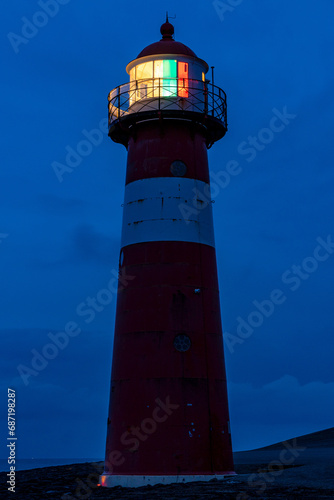 short lighthouse of Westkapelle, Netherlands at dusk