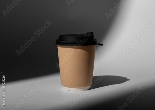 Kraft brown paper cup mock up, coffee mug to go covered with black cap