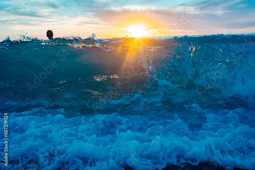 Obraz na plátně A lone figure glides through the tranquil waters of hawaii's kauai and oahu, bas