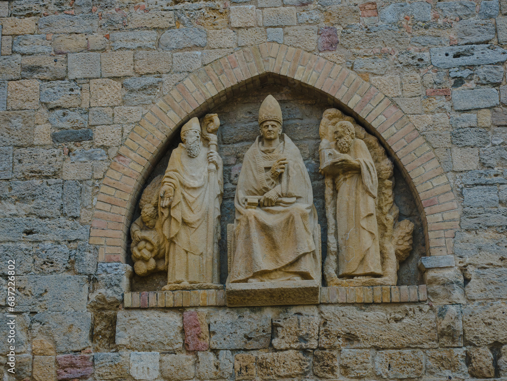 Relief of Pope St. Linus in the outside wall of Volterra cathedral, Italy